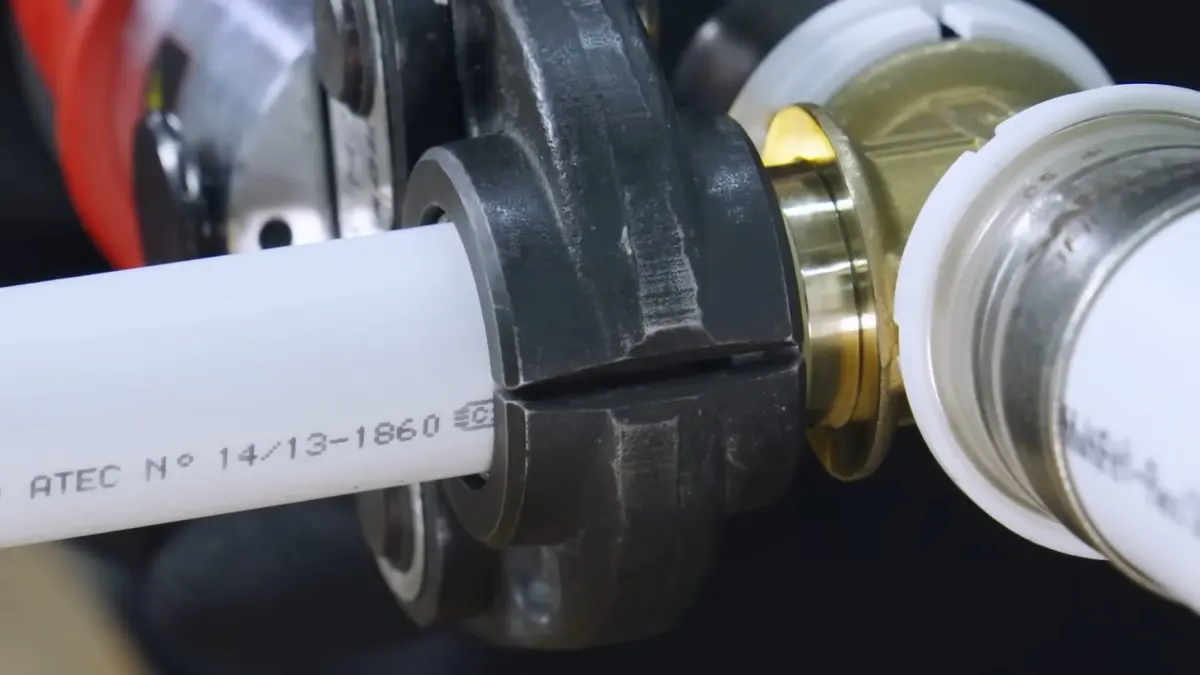 Close-up plumbing tool or pipe fitting on a work surface for Contact Altadena Plumbing Pros