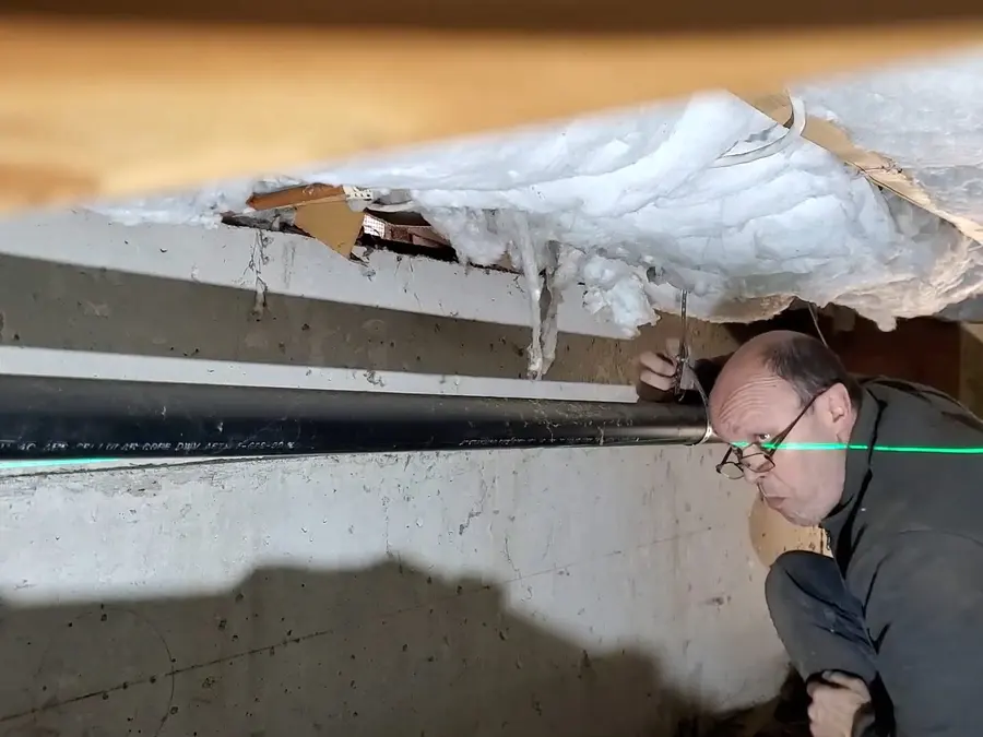 Crawlspace drain piping and cleanout work below a home related to Why Your Altadena Bungalow's Galvanized Pipes Are Failing Now on the blog1-side section