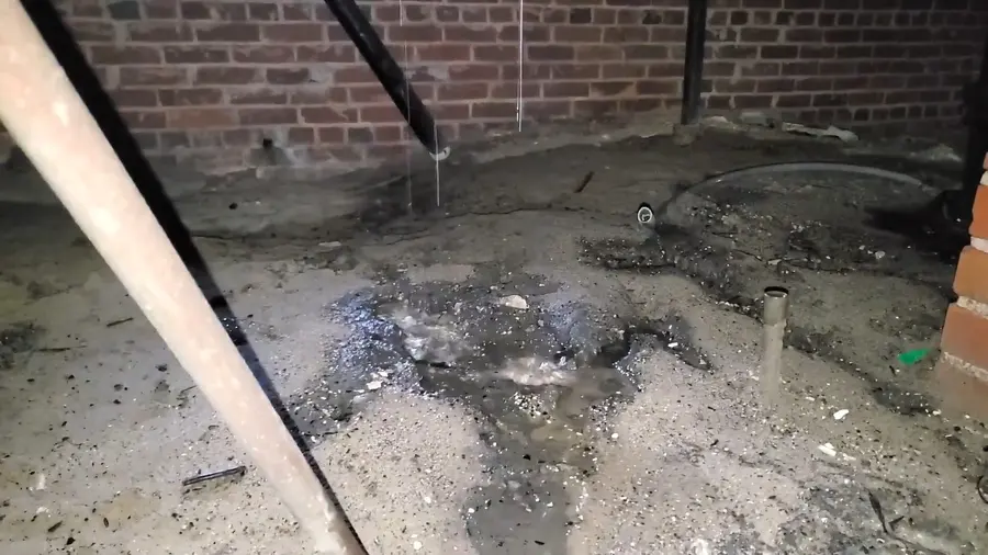 Crawlspace drain piping and cleanout work below a home related to When to Call an Emergency Plumber
