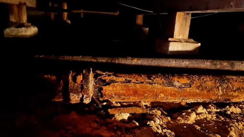 Exposed sewer pipe and repair access in soil related to How Much Does Sewer Line Replacement Cost in the SGV?