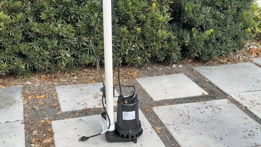 Sump pump basin, discharge pipe, and pump components related to Rainy Season Plumbing Prep for SGV Foothill Homes