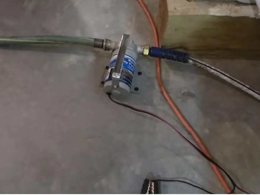 Sump pump basin, discharge pipe, and pump components related to About Altadena Plumbing Pros