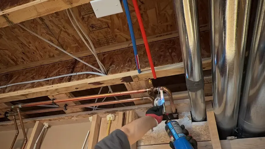 Utility sink drain and supply line installation work during a plumbing service visit in Janes Village