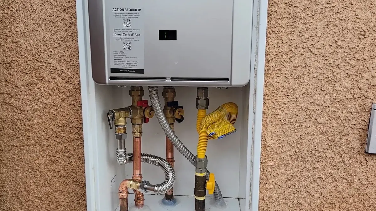 Wall-mounted tankless water heater connections and maintenance valves for Water Heater Installation & Replacement in Altadena, CA