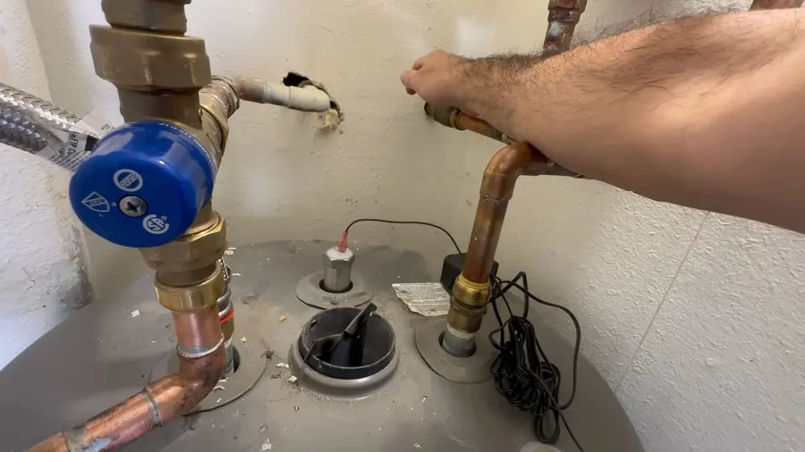 Water heater anode rod and top tank fittings during a plumbing service visit in Atwater Village