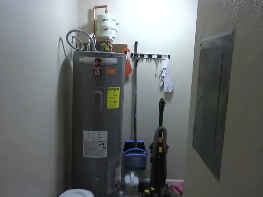 Residential water heater tank, supply lines, and service fittings during a plumbing service visit in Atwater Village