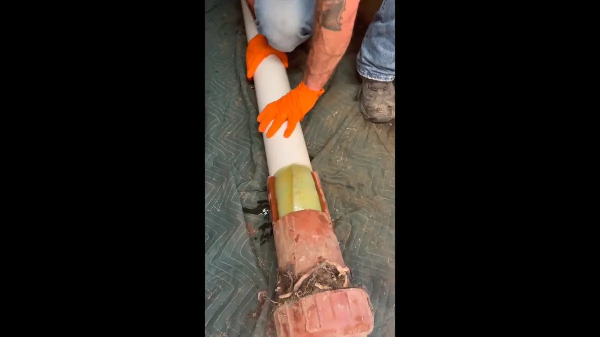 Water service line and meter connection work in soil during a plumbing service visit in Las Flores